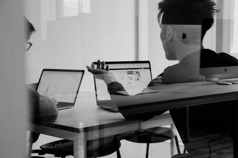 Professionals sharing candid recommendations during a collaborative working session